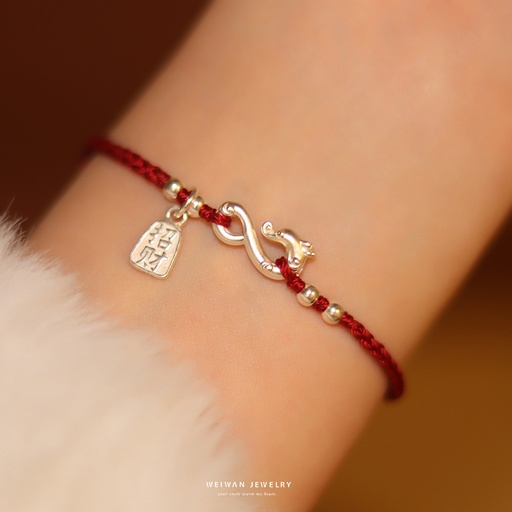 Female pure silver bracelet with late - transformed flying snake into dragon design, red hand cord for the Chinese zodiac year of the snake, a new Chinese - style gift with metaphysical significance for the Year of the Snake